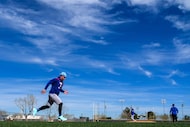 Texas Rangers outfielder Joc Pederson participates in a base running drill during a spring...