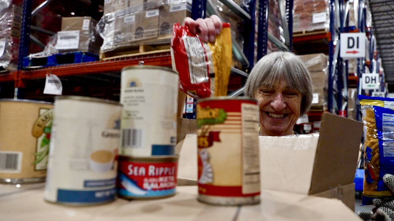 Martha shows groceries inside box .jpg