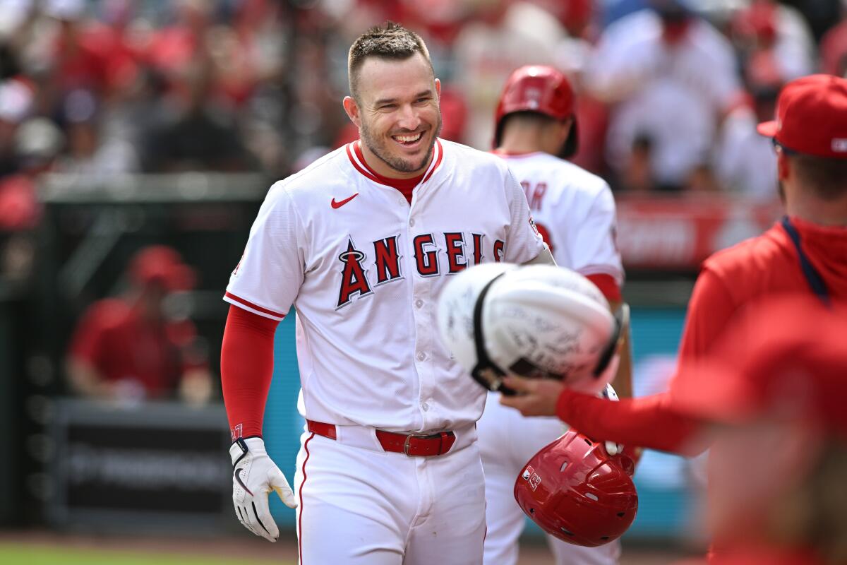 Angels star Mike Trout celebrates after hitting a solo home run against the Houston Astros on Sept. 28 in Anaheim.