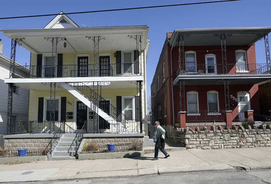 A woman walks down the street in Kansas City, Missouri, on Wednesday, March 3, 2021.