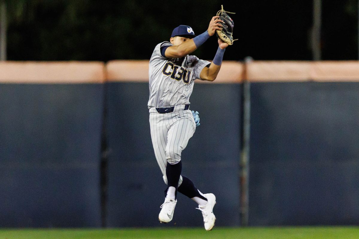 CBU Lancers infielder Chris Ramirez (1) jumps to record an out during an NCAA Baseball game against the CSUF Titans on February 13, 2026 in Fullerton, California.