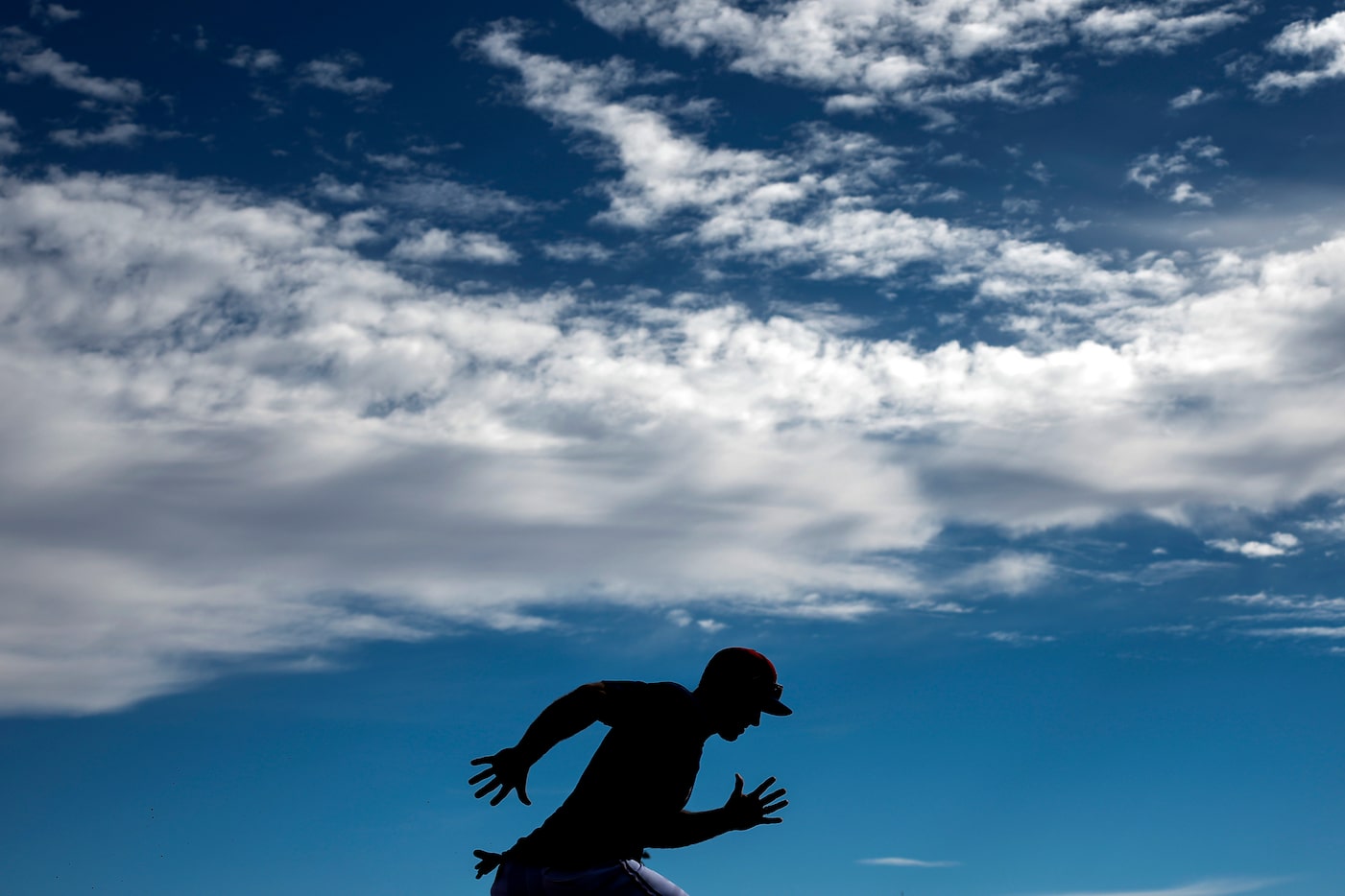 Texas Rangers outfielder Wyatt Langford participates in a baserunning drill during a spring...