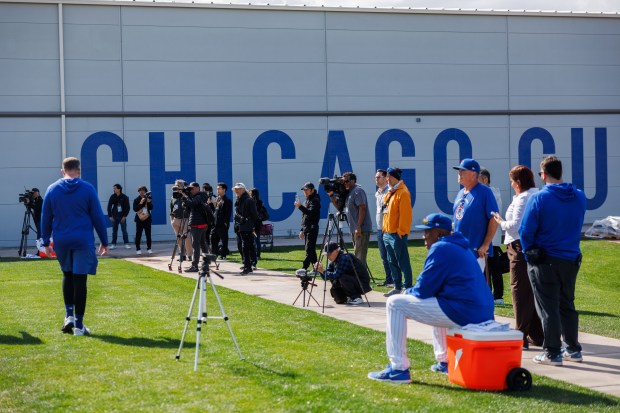 Members of the press watch pitcher Shota Imanaga throw in the bullpen area during spring training at Sloan Park on Tuesday, Feb. 17, 2026, in Mesa, Ariz. (Armando L. Sanchez/Chicago Tribune)
