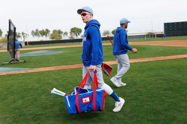 Pete Crow-Armstrong walks to home plate before batting practice during the first day of the Cubs full-squad workout at spring training at Sloan Park on Feb. 16, 2026, in Mesa, Ariz. (Armando L. Sanchez/Chicago Tribune)