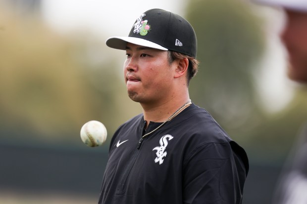 White Sox infielder Munetaka Murakami tosses a ball in his hand after fielding balls during spring training at Camelback Ranch on Monday, Feb. 16, 2026, in Glendale, Ariz. (Eileen T. Meslar/Chicago Tribune)
