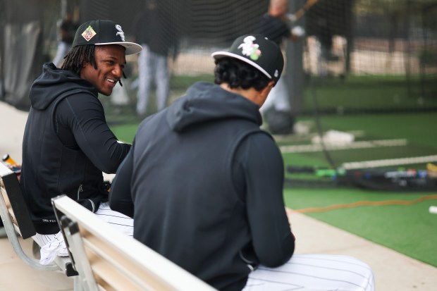 White Sox players Luisangel Acuña, left, and Everson Pereira chat as they sit outside the batting cages during spring training at Camelback Ranch on Monday, Feb. 16, 2026, in Glendale, Ariz. (Eileen T. Meslar/Chicago Tribune)