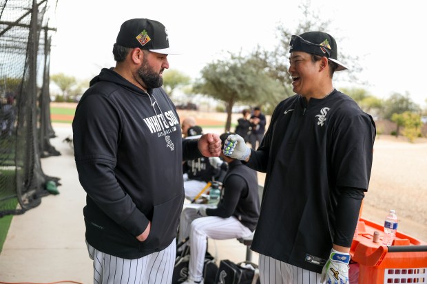 White Sox hitting coach Derek Shomon chats with infielder Munetaka Murakami outside the batting cages during spring training at Camelback Ranch on Monday, Feb. 16, 2026, in Glendale, Ariz. (Eileen T. Meslar/Chicago Tribune)