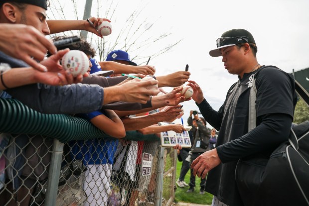 White Sox infielder Munetaka Murakami signs autographs for fans during spring training at Camelback Ranch on Monday, Feb. 16, 2026, in Glendale, Ariz. (Eileen T. Meslar/Chicago Tribune)