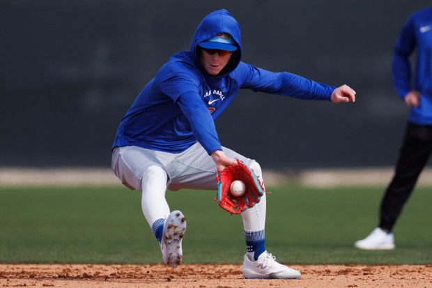 Cubs center fielder Pete Crow-Armstrong fields a ball during a spring training drill at Sloan Park on Feb. 18, 2026, in Mesa, Ariz. (Armando L. Sanchez/Chicago Tribune)