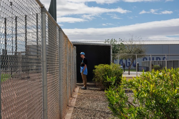 Nathan Kinzler, 16, of Atlanta, watches Cubs players practice during spring training at Sloan Park on Feb. 18, 2026, in Mesa, Ariz. (Armando L. Sanchez/Chicago Tribune)