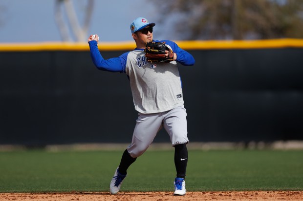 Cubs right fielder Seiya Suzuki throws a ball during fielding drills at spring training on Feb. 18, 2026, at Sloan Park in Mesa, Ariz. (Armando L. Sanchez/Chicago Tribune)
