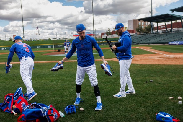 Dansby Swanson and Alex Bregman leave the field after live batting practice during spring training at Sloan Park on Tuesday, Feb. 17, 2026, in Mesa, Ariz. (Armando L. Sanchez/Chicago Tribune)