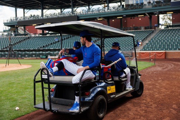 Dansby Swanson rides a golf cart after live batting practice during spring training at Sloan Park on Tuesday, Feb. 17, 2026, in Mesa, Ariz. (Armando L. Sanchez/Chicago Tribune)