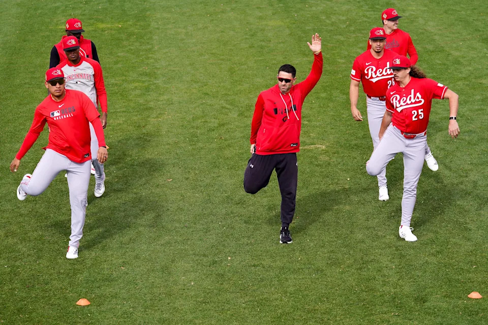 Cincinnati Reds pitchers warmup ahead of running drills in Goodyear