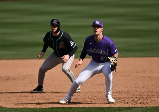 Colorado Rockies infielder, Charlie Condron, right, guards first base during the action of the first 2026 spring training game at Salt River Field at Talking Stick in Scottsdale, Arizona on Feb. 20, 2026. The Arizona Diamondbacks went onto beat the Colorado Rockies 3-2. (Photo by RJ Sangosti/The Denver Post)