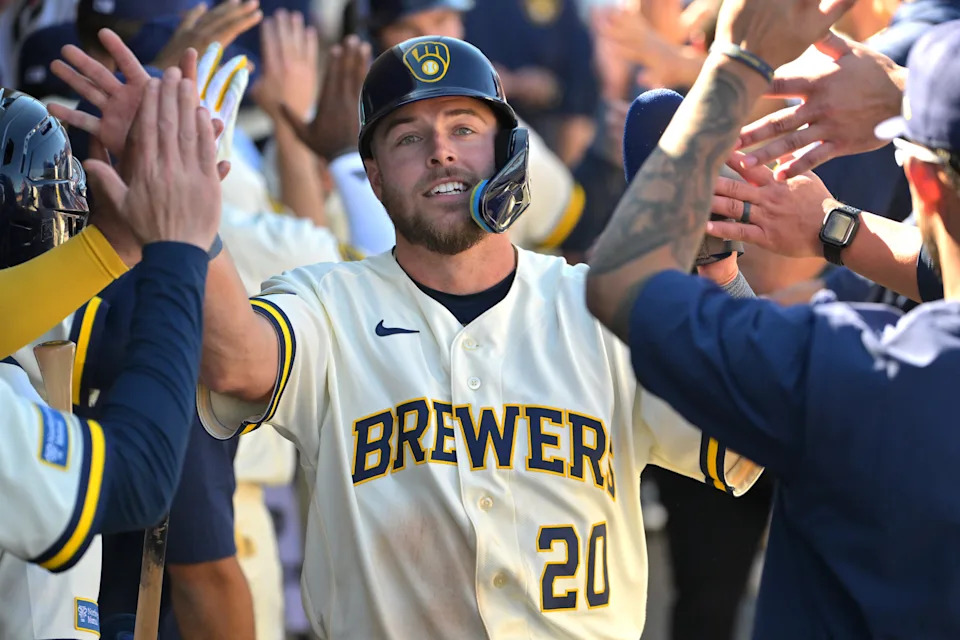 Brewers outfielder Brandon Lockridge is congratulated by teammates after scoring on a double by David Hamilton in the fourth inning against the Cleveland Guardians at American Family Fields of Phoenix.