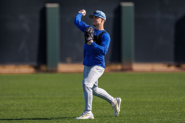 Matt Shaw throws in the outfield during Cubs spring training at Sloan Park on Feb. 19, 2026, in Mesa, Ariz. (Armando L. Sanchez/Chicago Tribune)