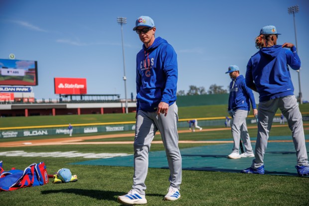 Cubs manager Craig Counsell walks on the field during batting practice at spring training at Sloan Park on Feb. 19, 2026, in Mesa, Ariz. (Armando L. Sanchez/Chicago Tribune)