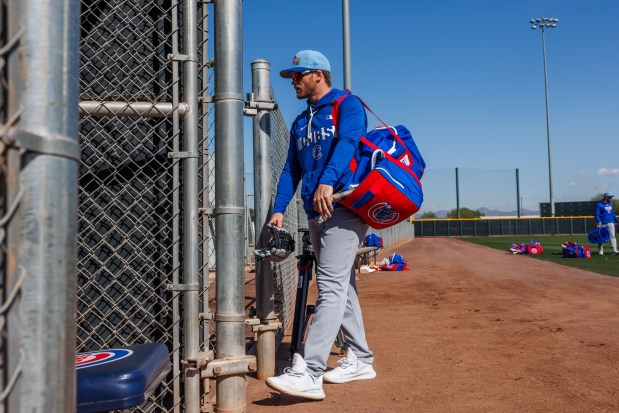 Cubs left fielder Ian Happ walks off a practice field during spring training at Sloan Park on Feb. 19, 2026, in Mesa, Ariz. (Armando L. Sanchez/Chicago Tribune)
