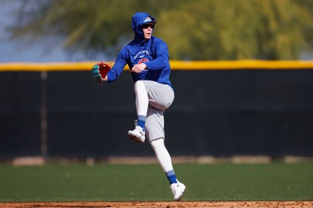 Cubs center fielder Pete Crow-Armstrong jumps after throwing a ball during a fielding drill at spring training on Feb. 18, 2026, at Sloan Park in Mesa, Ariz. (Armando L. Sanchez/Chicago Tribune)