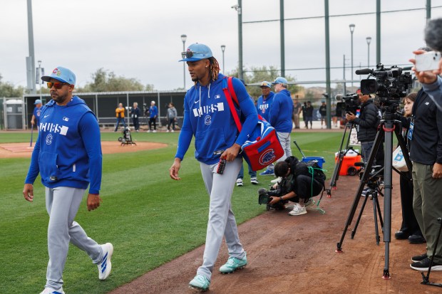 Kevin Alcantara walks to a practice field before warming up during the first day of the Cubs full-squad workout at spring training at Sloan Park on Feb. 16, 2026, in Mesa, Ariz. (Armando L. Sanchez/Chicago Tribune)