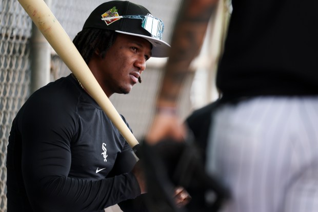 White Sox second baseman Luisangel Acuña sits in the dugout with teammates during spring training at Camelback Ranch on Feb. 18, 2026 in Glendale, Ariz. (Eileen T. Meslar/Chicago Tribune)