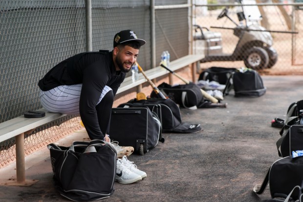 White Sox catcher Edgar Quero puts on his cleats in a dugout during spring training at Camelback Ranch on Feb. 18, 2026, in Glendale, Ariz. (Eileen T. Meslar/Chicago Tribune)