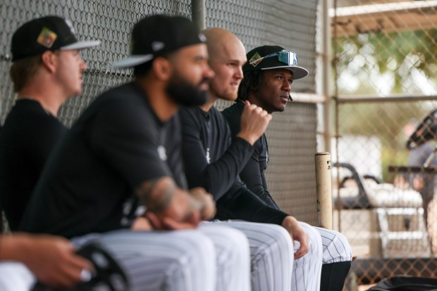 White Sox second baseman Luisangel Acuña sits in a dugout with teammates during spring training at Camelback Ranch on Feb. 18, 2026, in Glendale, Ariz. (Eileen T. Meslar/Chicago Tribune)