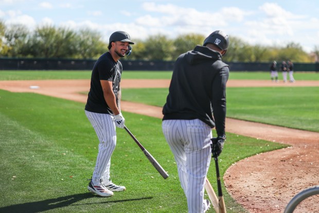 Chicago White Sox center fielder Everson Pereira, left, laughs with second baseman Lenyn Sosa as they wait to take live batting practice during spring training at Camelback Ranch in Glendale, Ariz., on Tuesday, Feb. 17, 2026. (Eileen T. Meslar/Chicago Tribune)