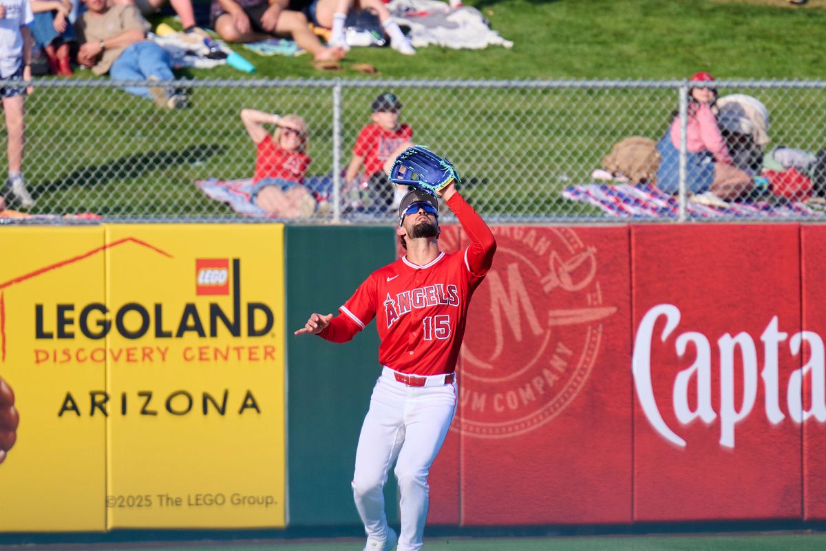 The Los Angeles angels outfielder Matthew Lugo (15) catches a pop fly against the Los Angeles Dodgers, February 21st, 2026 in Tempe Arizona.