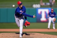 Texas Rangers pitcher Ryan Lobus delivers during the seventh inning of a spring training...