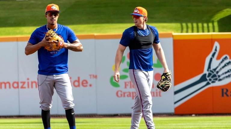 New York Mets players Mark Vientos, left, and Brett Baty...
