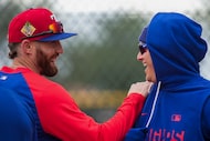 Texas Rangers outfielder Brandon Nimmo (left) laughs with infielder Joc Pederson during a...