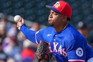 Texas Rangers pitcher Alexis Díaz delivers during the sixth inning of a spring training game...