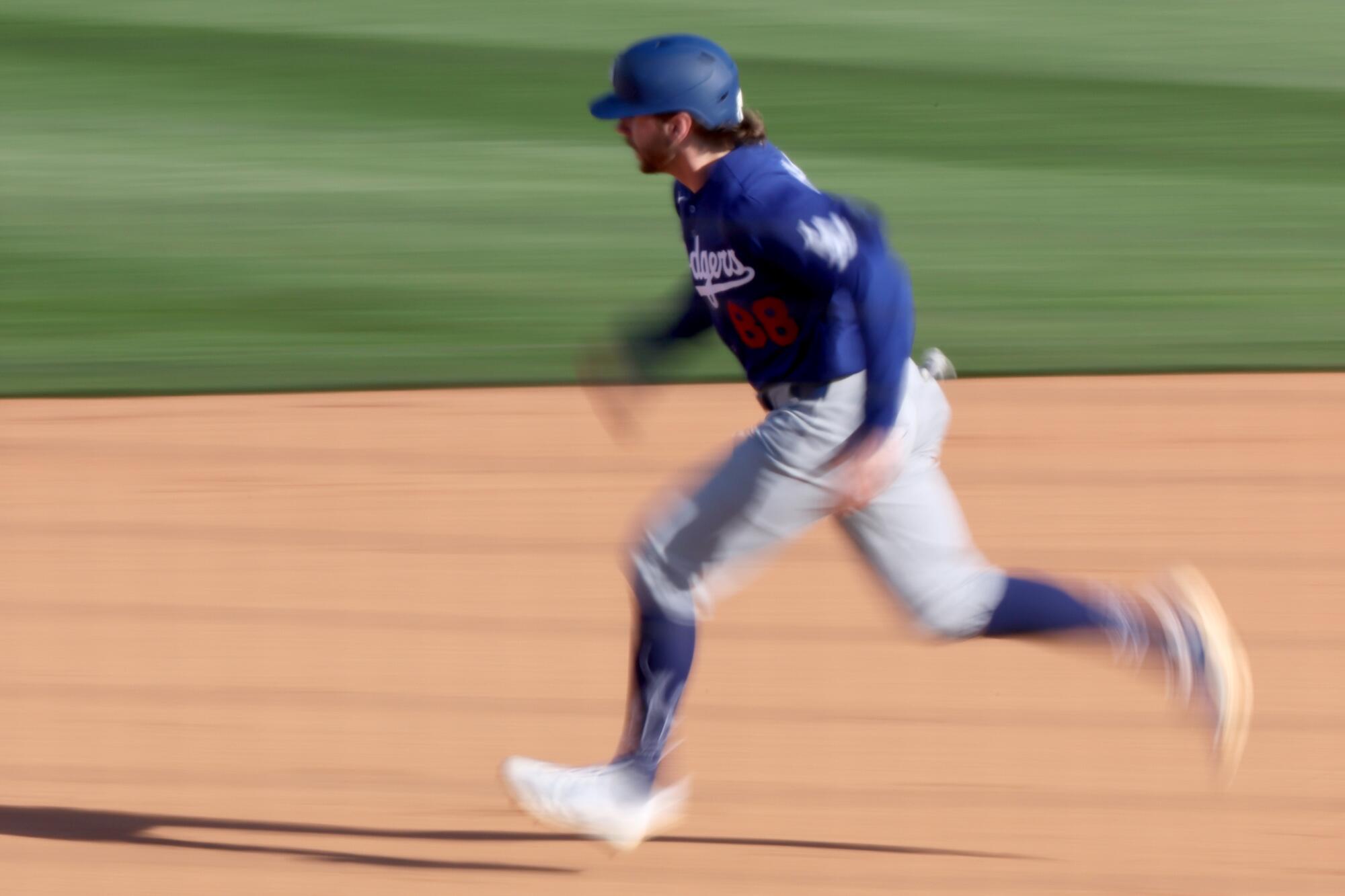 Noah Miller runs the bases during a spring training game against the Angels on Feb. 21.