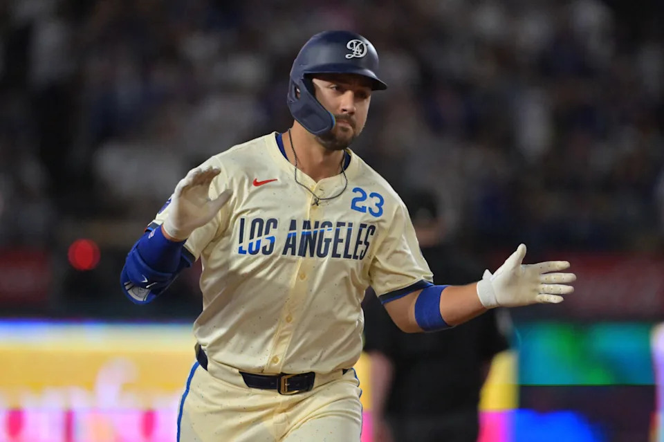 Los Angeles Dodgers outfielder Michael Conforto (23) reacts after scoring a run during the third inning against the San Francisco Giants at Dodger Stadium.