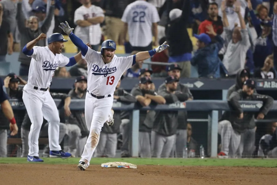 epa07123223 Los Angeles Dodgers batter Max Muncy celebrates after hitting a game-winning walk off home run against the Boston Red Sox in the bottom of the eighteenth inning of game three of the World Series at Dodger Stadium in Los Angeles, California, USA, 26 October 2018. The Red Sox lead the best-of-seven series 2-1 to determine the champion of Major League Baseball. EPA/ADAM DAVIS EPA