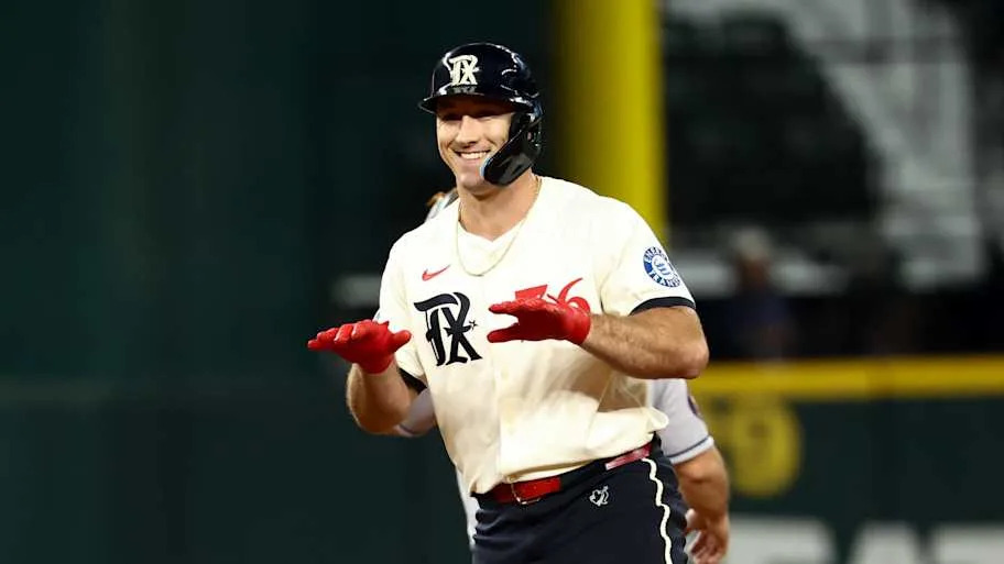 Texas Rangers left fielder Wyatt Langford reacts after hitting a double.