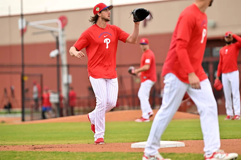 Feb 11, 2026; Clearwater, FL, USA; Philadelphia Phillies pitcher Aaron Nola (27) runs a drill during spring training at BareCare Ballpark. Mandatory Credit: Jonathan Dyer-Imagn Images