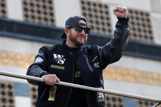 Los Angeles Dodgers third baseman Max Muncy acknowledges the crowd during the World Series championship parade at downtown Los Angeles.