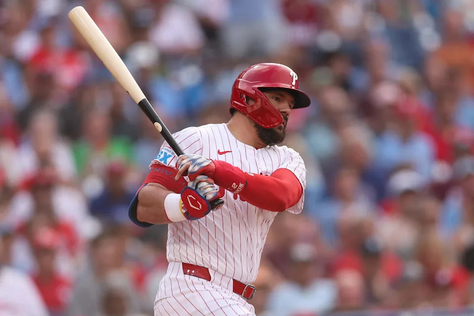 Jul 19, 2025; Philadelphia, Pennsylvania, USA; Philadelphia Phillies outfielder Kyle Schwarber (12) hits a double during the first inning against the Los Angeles Angels at Citizens Bank Park. Mandatory Credit: Bill Streicher-Imagn Images