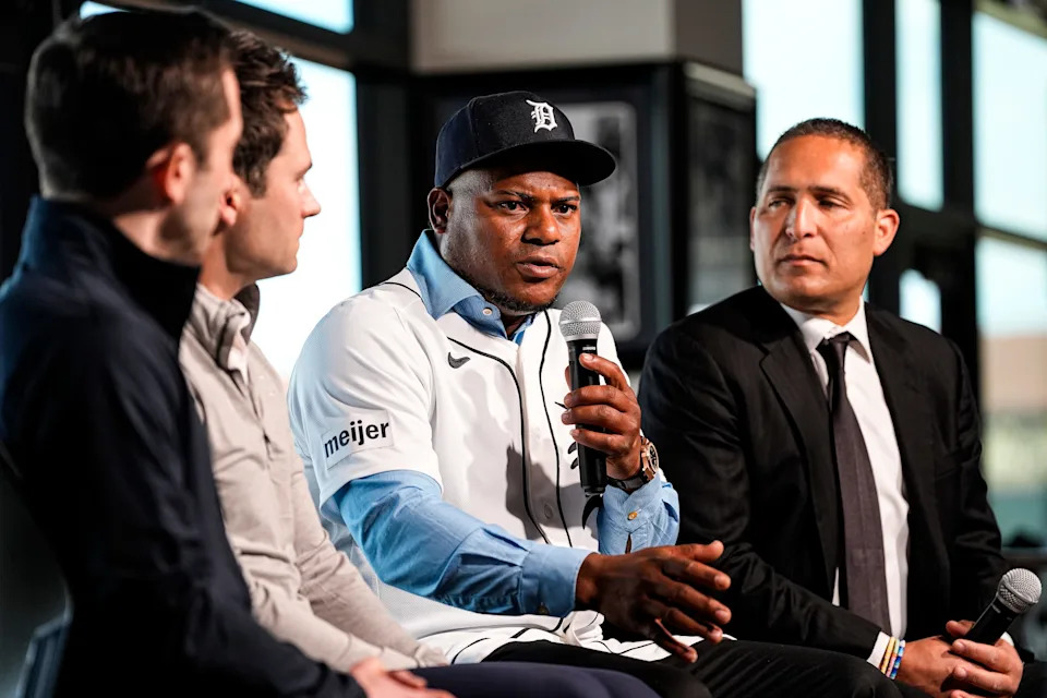 Detroit Tigers pitcher Framber Valdez, center right, speaks next to president of baseball operations Scott Harris, center left, and general manager Jeff Greenberg, left, during Valdez’s introductory press conference at the 34 Club of Joker Marchant Stadium in Lakeland, Fla. on Wednesday, Feb. 11, 2026.