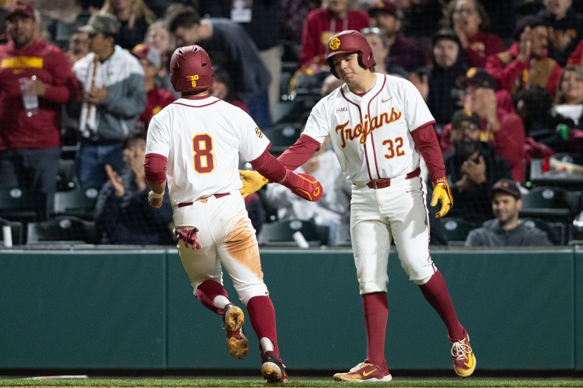 USC Trojan infielder Kevin Takeuchi (8) gets's a high five from catcher Richard Tejeda (32) after scoring during an NCAA Men's baseball game between the USC Trojans and Pepperdine Wave Friday February 13,2026 at Dedeaux Field in Los Angeles Calif USC Trojan infielder Kevin Takeuchi (8) gets's a high five from catcher Richard Tejeda (32) after scoring during an NCAA Men's baseball game between the USC Trojans and Pepperdine Wave Friday February 13,2026 at Dedeaux Field in Los Angeles Calif