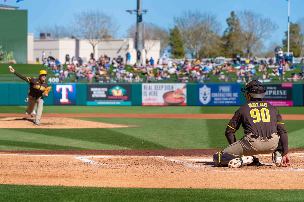 San Diego Padres catcher Ethan Salas (90) catches while San Diego Padres relief pitcher Ron Marinaccio (97) throws during an MLB Spring Training game between the San Diego Padres and the Kansas City Royals, Saturday February 21, 2026 at Surprise Stadium in Surprise, AZ. San Diego Padres catcher Ethan Salas (90) catches while San Diego Padres relief pitcher Ron Marinaccio (97) throws during an MLB Spring Training game between the San Diego Padres and the Kansas City Royals, Saturday February 21, 2026 at Surprise Stadium in Surprise, AZ.