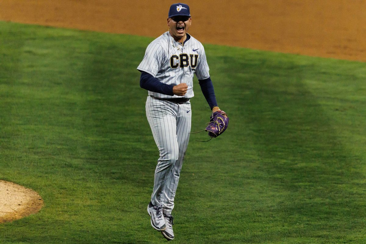 CBU Lancers pitcher Alfredo Capacete (23) celebrates after an inning-ending strikeout during an NCAA Baseball game against the CSUF Titans on February 13, 2026 in Fullerton, California.