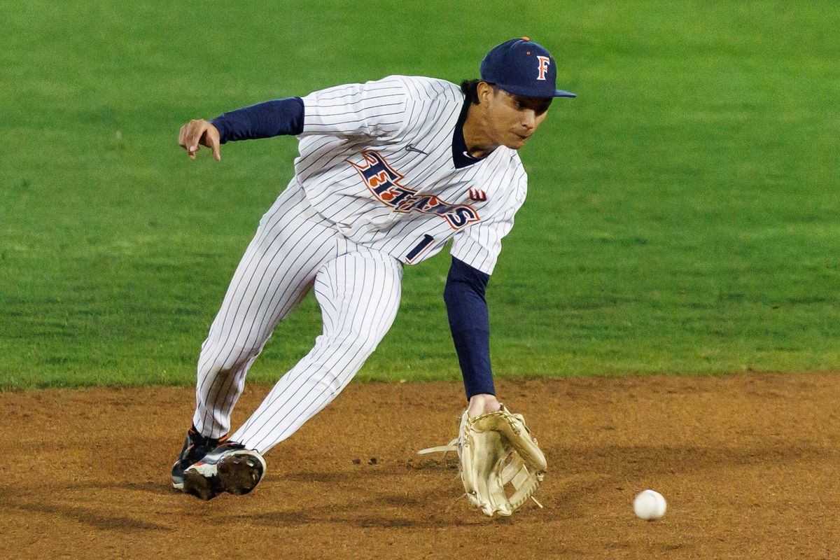 CSUF Titans infielder Eli Lopez (1) fields the ball during an NCAA Baseball game against the CBU Lancers on February 13, 2026 in Fullerton, California.