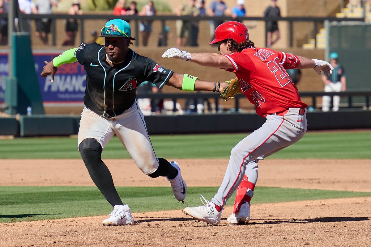 The Los Angeles Angels infielder Adam Frazier (20) gets tagged out against The Arizona Diamondbacks ,February 22nd, 2026 in Scottsdale Arizona. The Los Angeles Angels infielder Adam Frazier (20) gets tagged out against The Arizona Diamondbacks ,February 22nd, 2026 in Scottsdale Arizona.