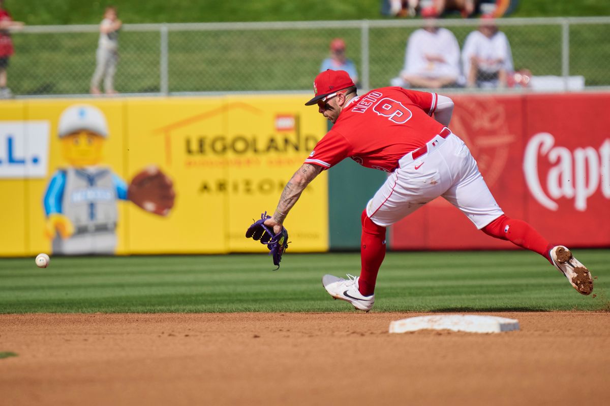 The Los Angeles Angels short stop Zach Neto (9) reaches for the ball  against The Texas Rangers ,February 23rd, 2026 in Tempe  Arizona.
