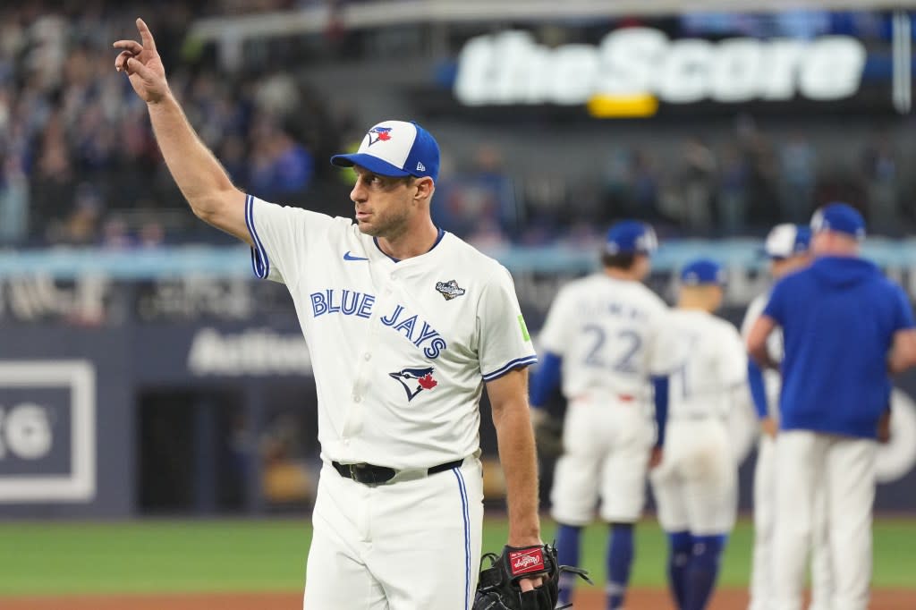 Blue Jays starter Max Scherzer walks to the dugout after being relieved during a World Series game against the Dodgers at Rogers Centre. Sports Illustrated via Getty Ima
