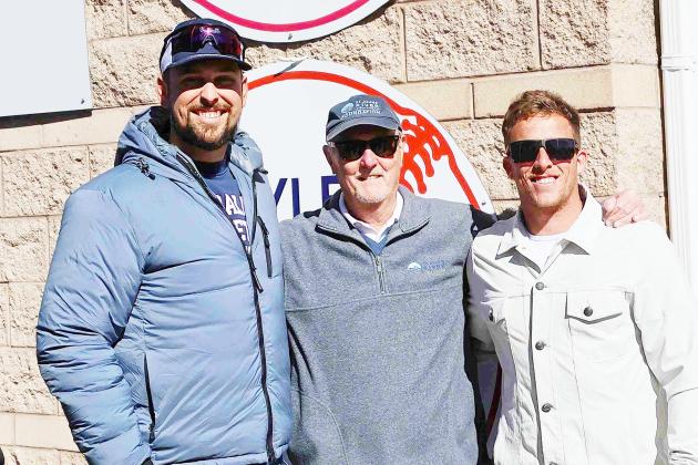 St. Johns River State College President Joe Pickens (center) poses with Nathaniel Lowe (left) and Myles Straw after the former SJRSC baseball players and Major League Baseball award winners had their uniform numbers retired in a ceremony at Tindall Field on Sunday. (RITA FULLERTON / Special to the Daily News)